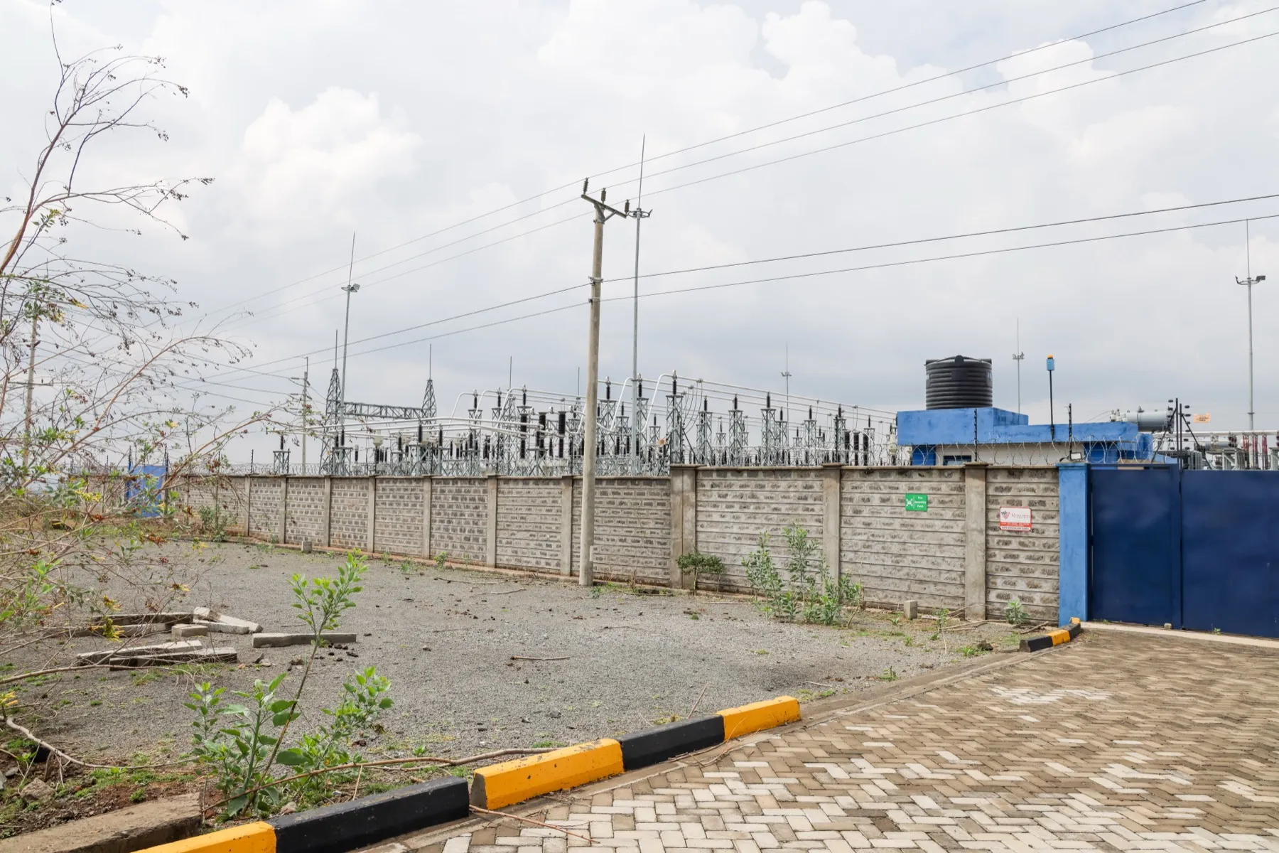 The 90 MVA substation serving Hells Gate, Naivasha SEZ — open-air switchyard, perimeter wall, dual transmission feed